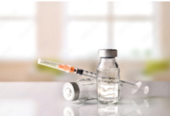 a syringe and vials of insulin